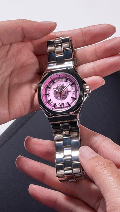 Guess Empress GW0551L1 held in hand showing silver bracelet and purple skeleton dial