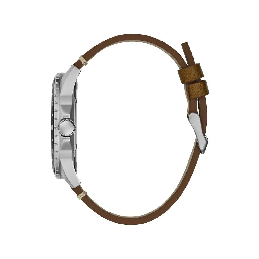 Side view of Guess watch displaying stainless steel case with brown leather strap