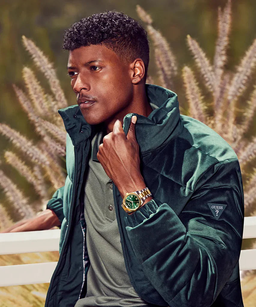 Guess GW0265G8 watch styled on man wearing green jacket outdoors