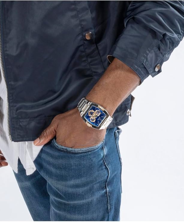 Guess GW0456G5 watch worn on wrist with navy jacket and denim