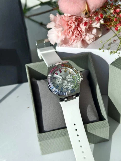Guess GW0541L1 women's watch on wrist with white strap, silver case, and crystal-set bezel