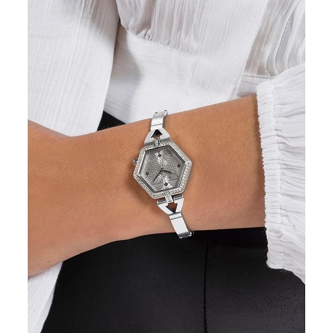 GUESS GW0680L1 silver watch worn on wrist with white sleeve