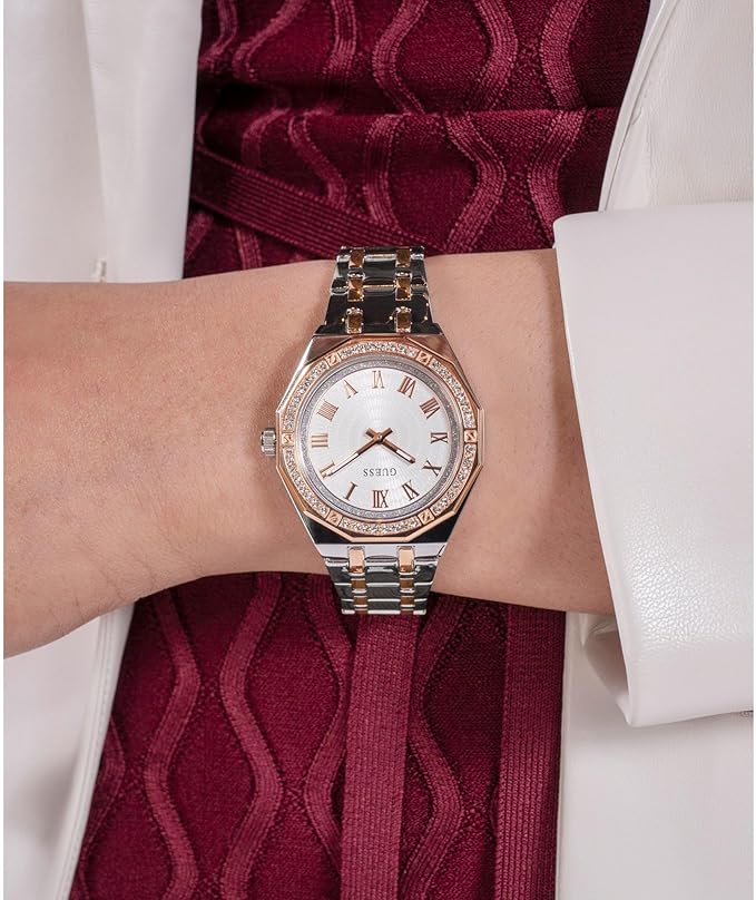 GUESS women's analog watch on wrist with burgundy and white clothing