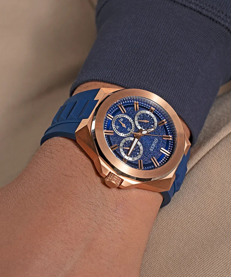 GUESS GW0799G2 blue and rose gold watch worn on wrist with blue strap