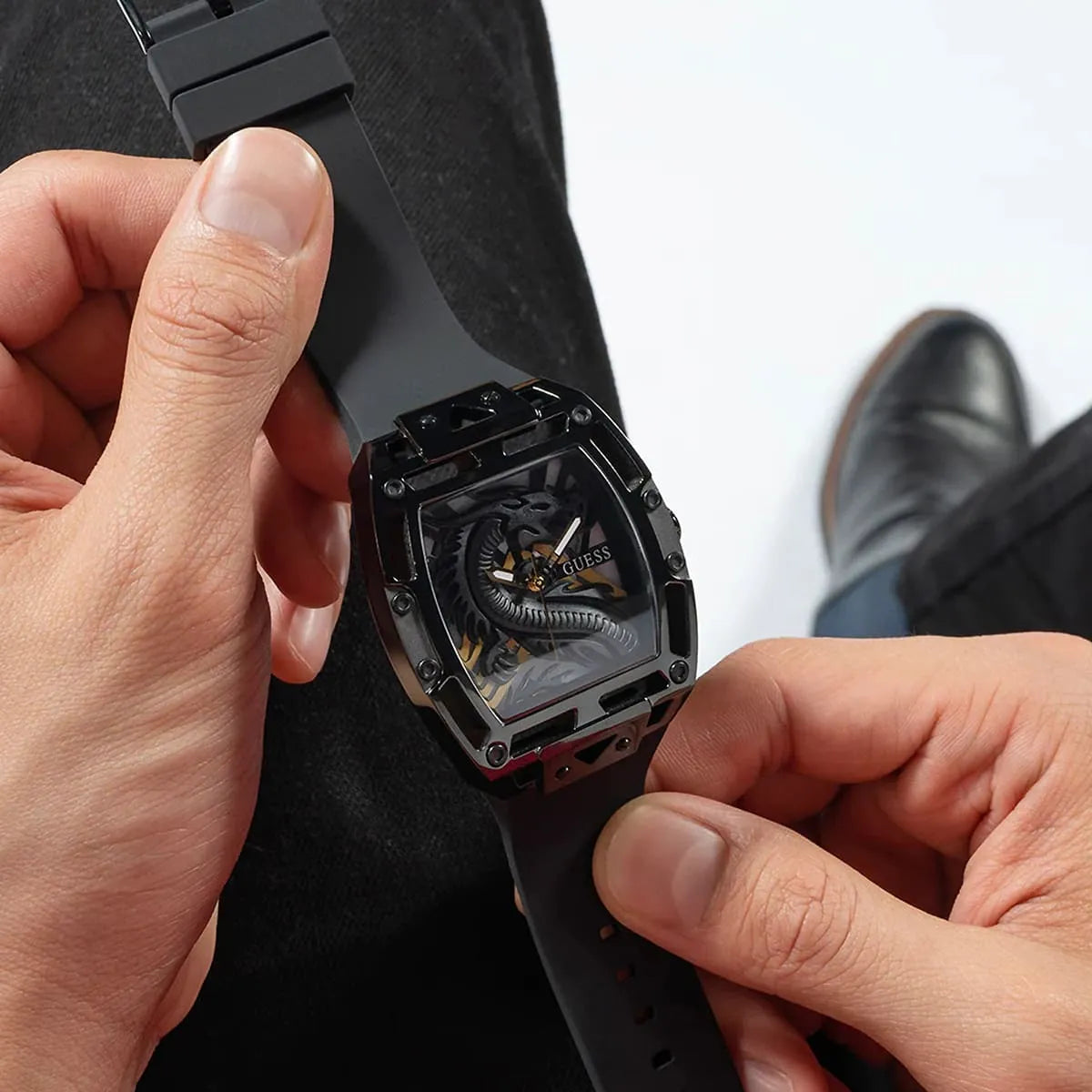 Guess Legend watch on wrist from side angle showing rectangular case design