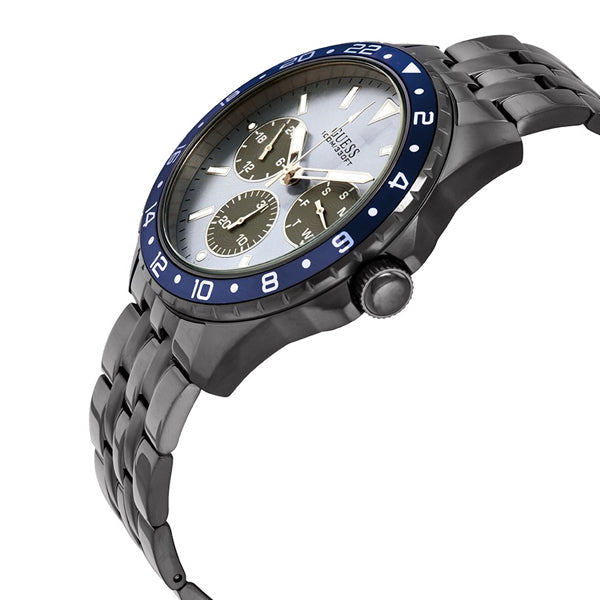Guess Odyssey watch at angle showing blue bezel, chronograph subdials, and stainless steel bracelet