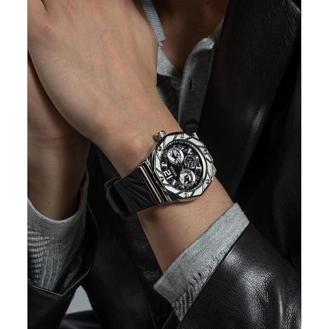 Guess Rival watch worn on wrist, showing black dial and silver-tone case in action