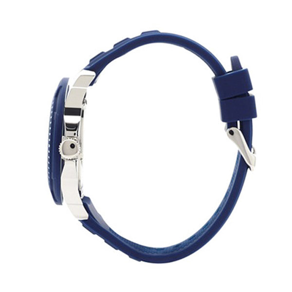 Guess Trade watch shown from side profile displaying blue silicone strap and dual-tone case