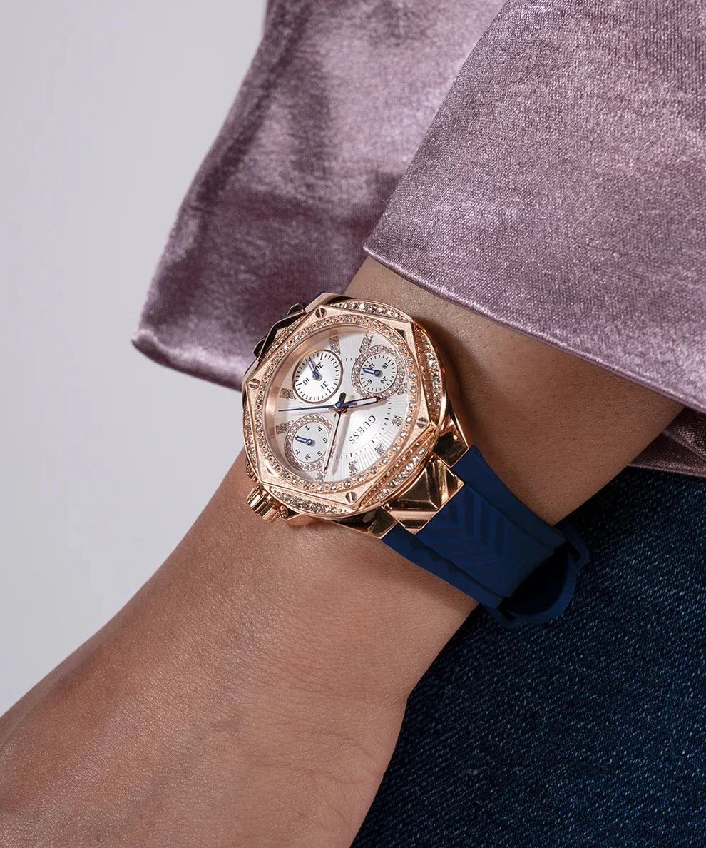 Guess Venus watch worn on wrist with rose gold case and blue strap
