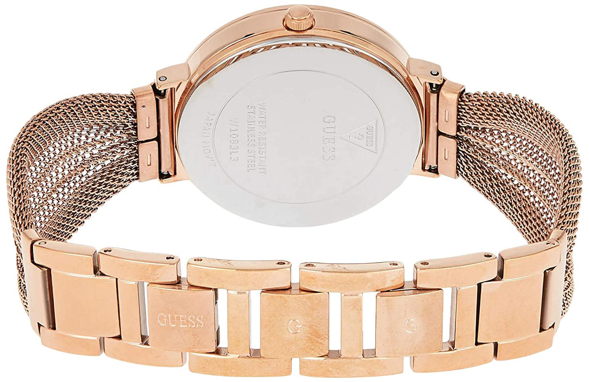 Guess W1083L3 watch caseback showing engraved text and mesh strap attachment