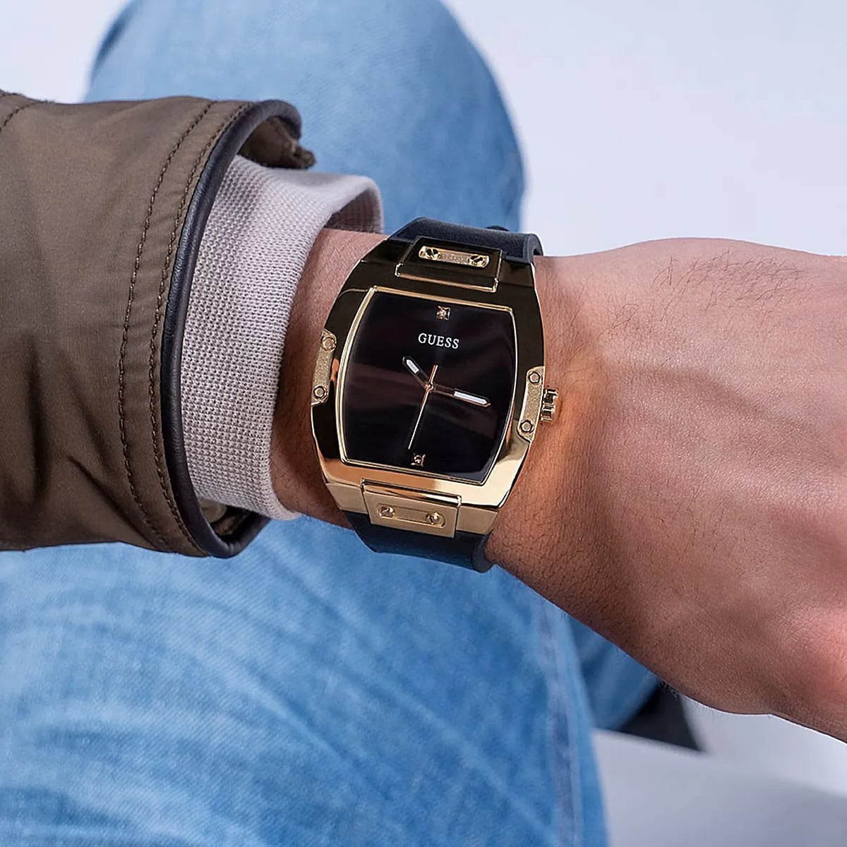 Guess Phoenix watch on wrist with casual styling, black dial visible from above