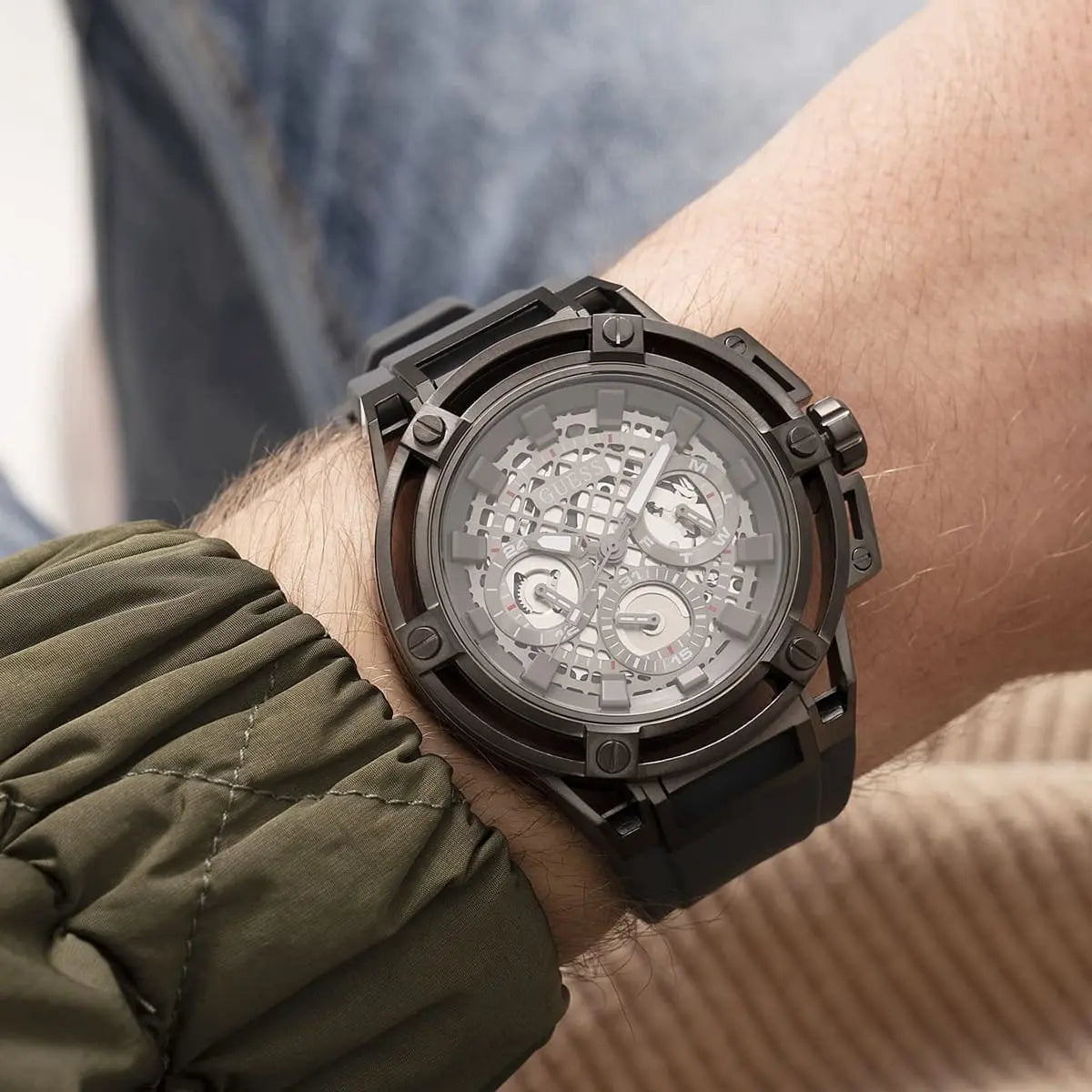 Guess Matrix chronograph watch on wrist displaying gunmetal dial