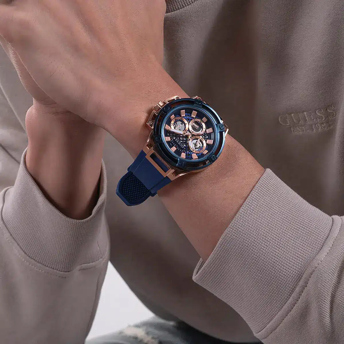 Guess Matrix watch worn on wrist showing blue dial and chronograph complications