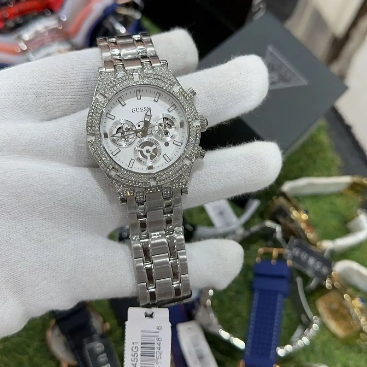 Guess GW0455G1 men's watch worn on wrist with silver dial and diamond-set bezel detail
