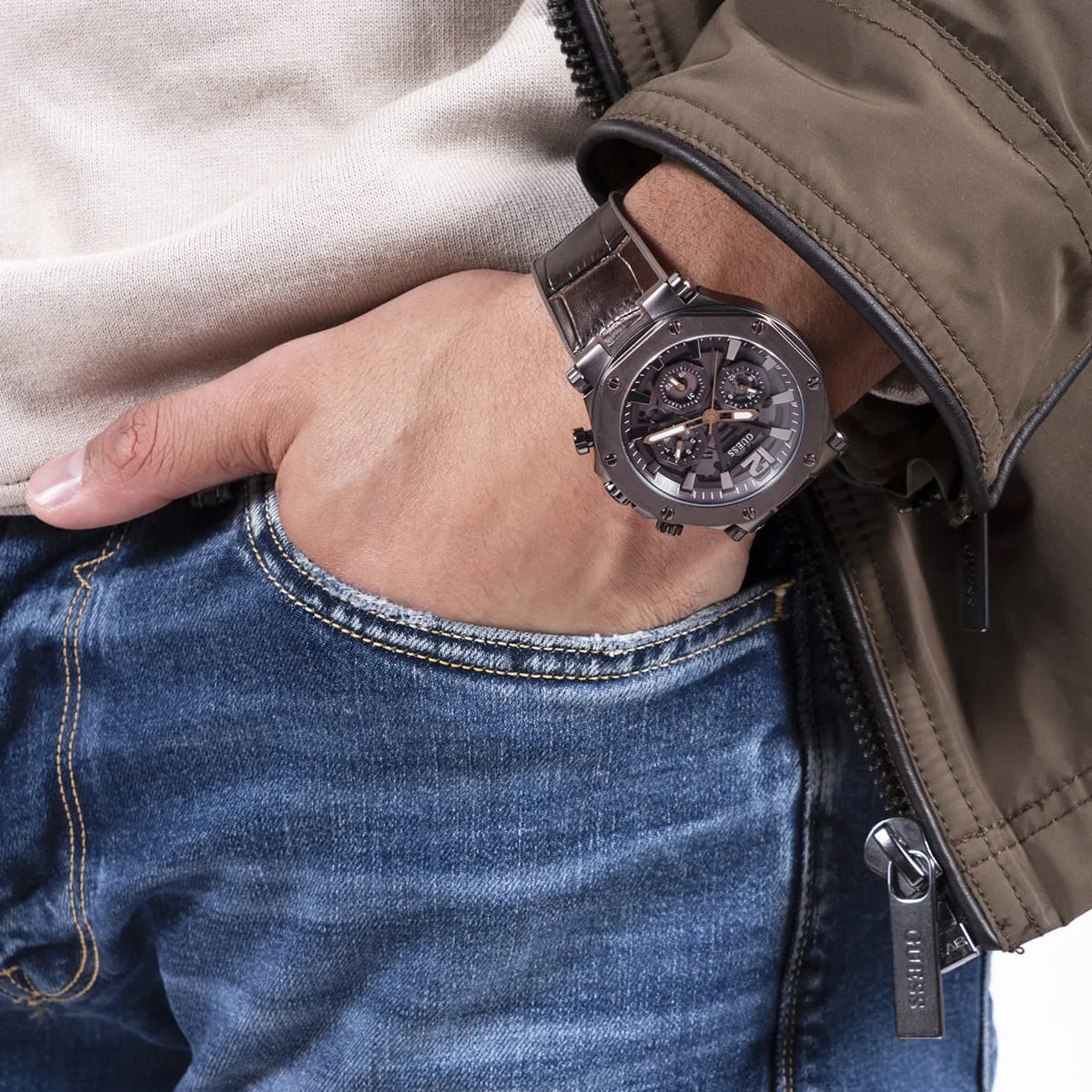 Guess Edge chronograph watch on wrist displaying brown case and leather strap detail