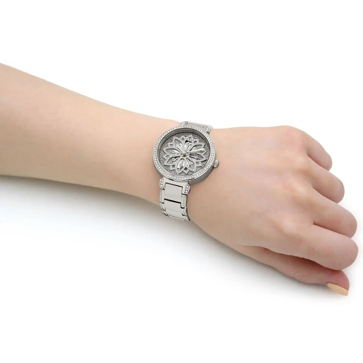 Guess Lily women's watch worn on wrist showing silver dial and steel bracelet fit