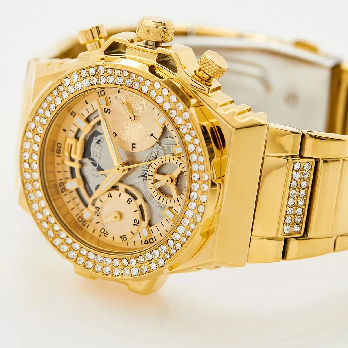 Guess Fusion dial detail with crystal bezel, multifunction subdials, and gold hands
