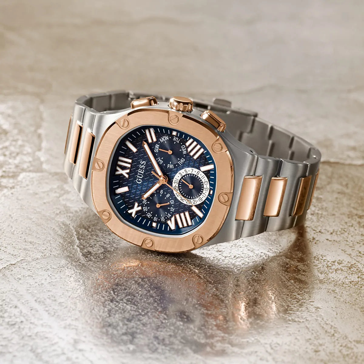 Guess Headliner multifunction watch with blue dial on textured surface