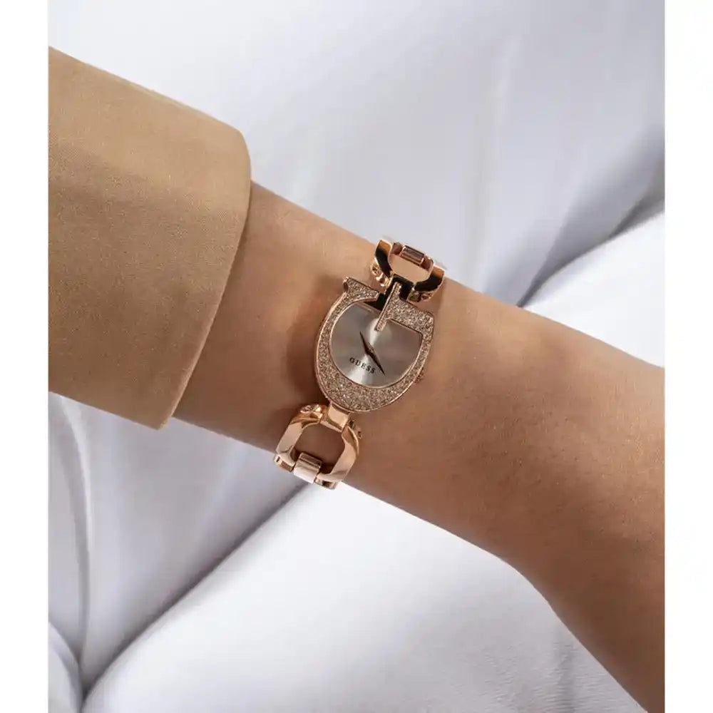 Guess rose gold women's watch GW0683L3 on wrist with crystal case and metal bracelet