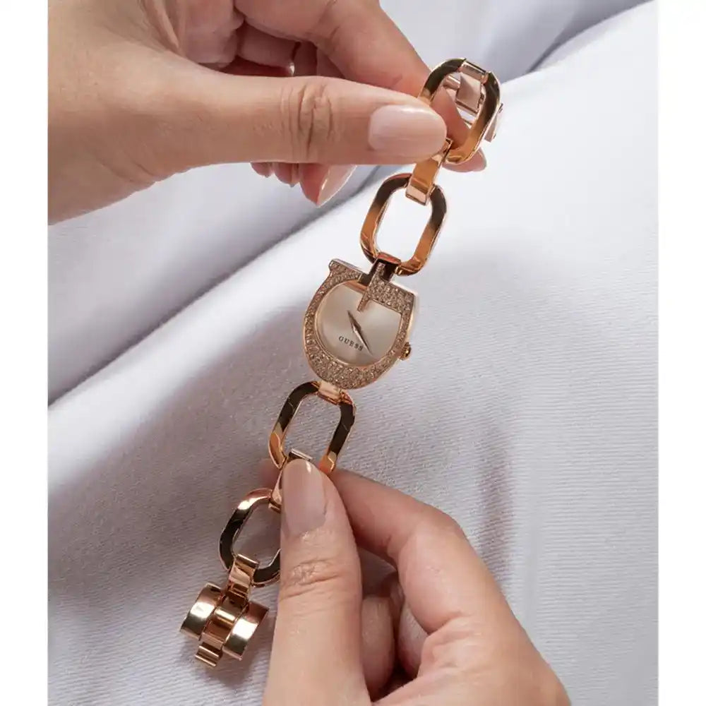 Guess rose gold watch GW0683L3 worn on wrist, showing crystal bezel and chain-link bracelet