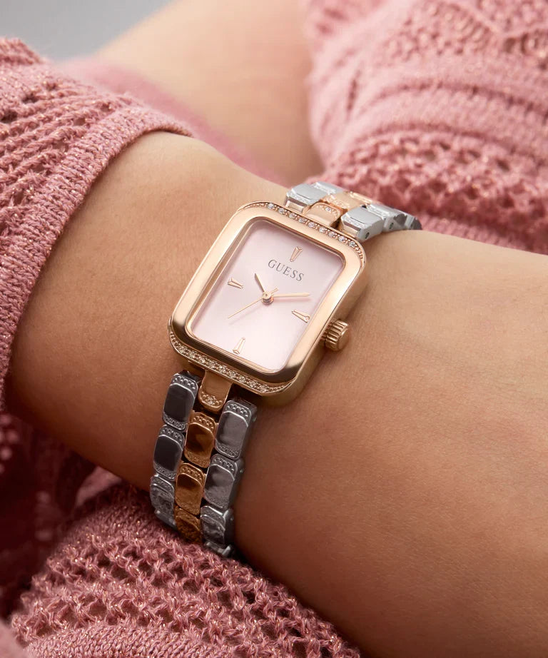 GUESS GW0865L5 watch on wrist against pink knit sleeve, side profile view
