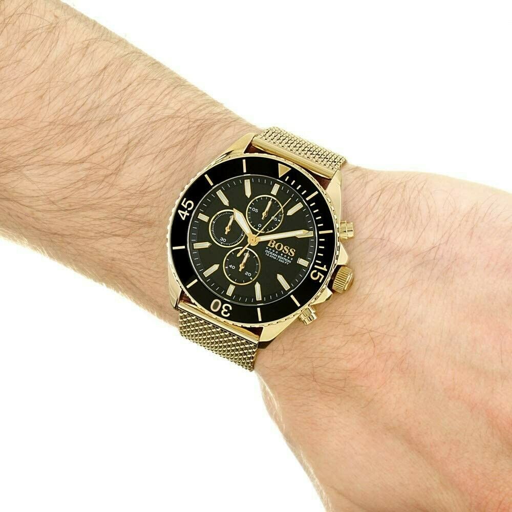 Hugo Boss yellow stainless steel chronograph watch worn on wrist