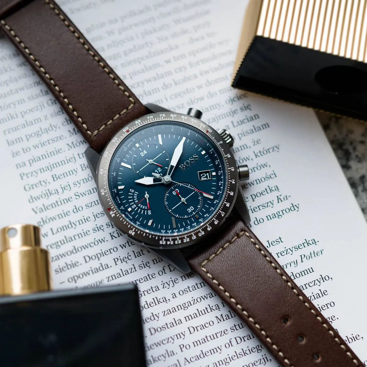 Hugo Boss Pilot chronograph watch on styled surface with brown leather strap detail