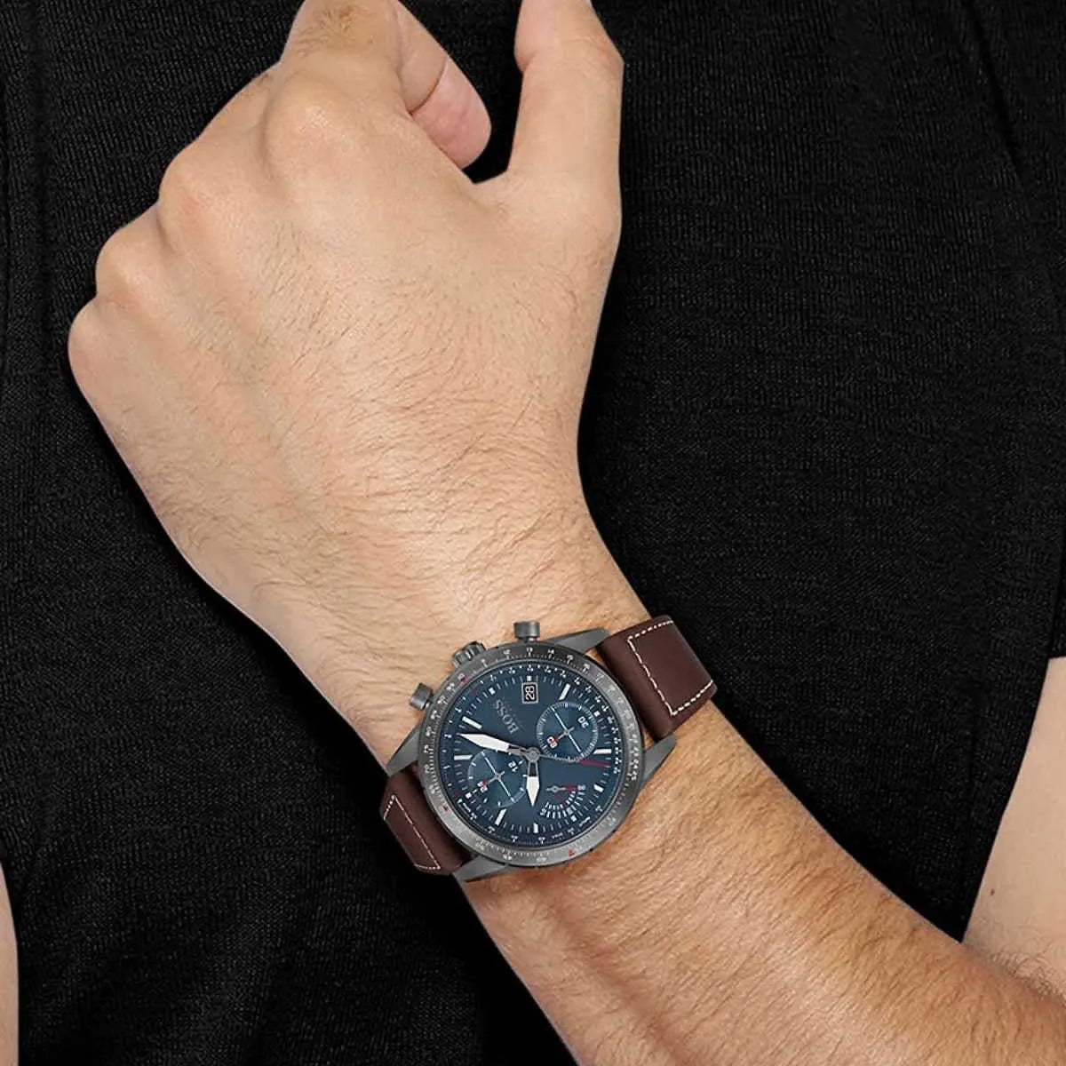 Hugo Boss Pilot chronograph men's watch worn on wrist with brown leather strap