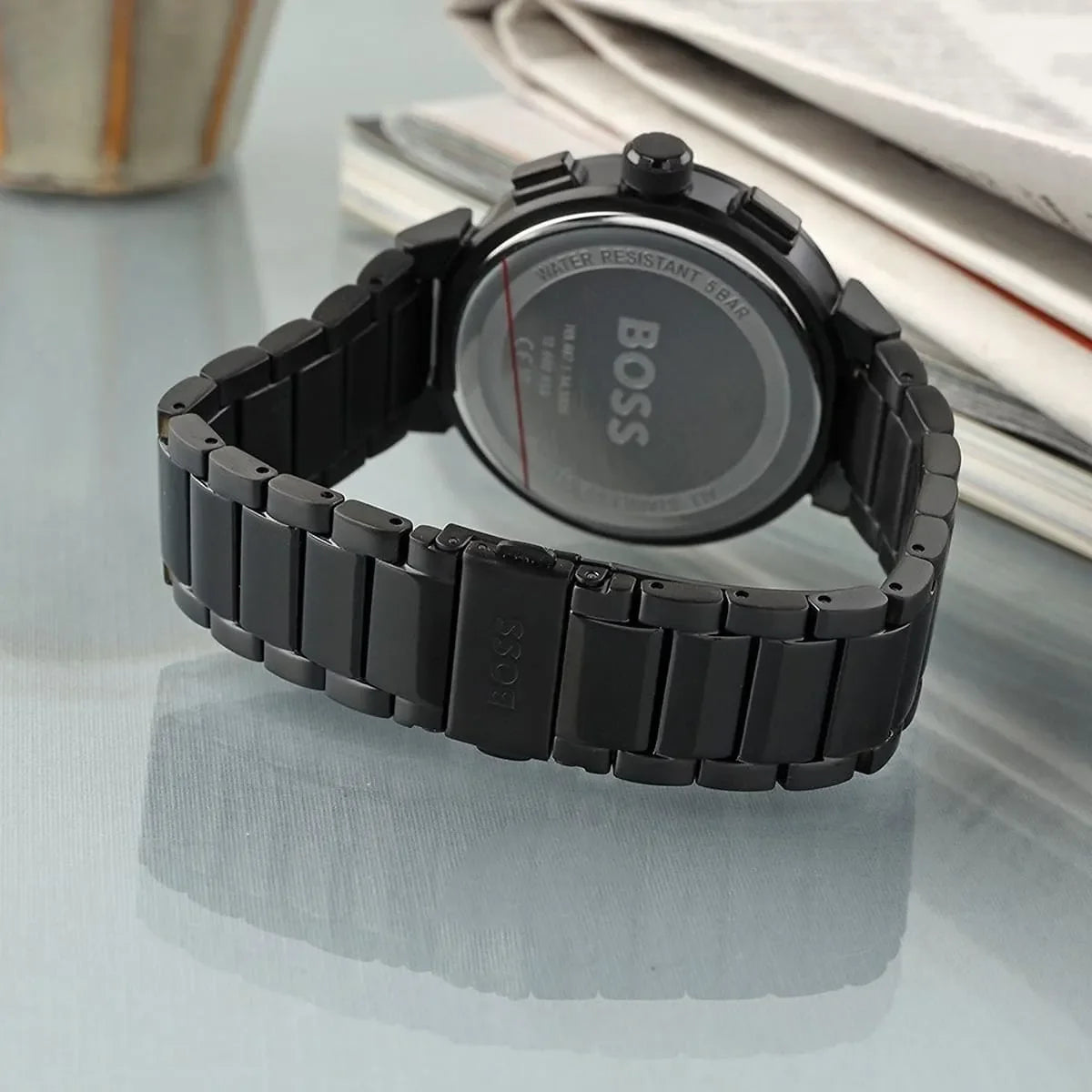 Hugo Boss 1514001 watch worn on wrist showing black dial and metal bracelet from back angle