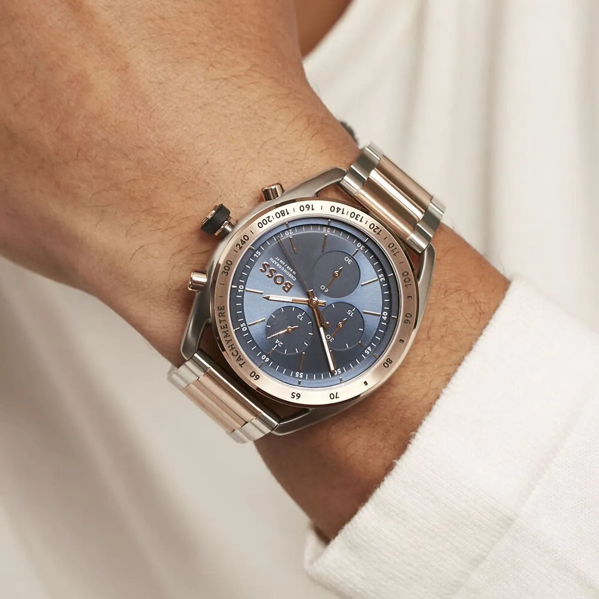 Hugo Boss two-tone chronograph watch worn on wrist with blue dial