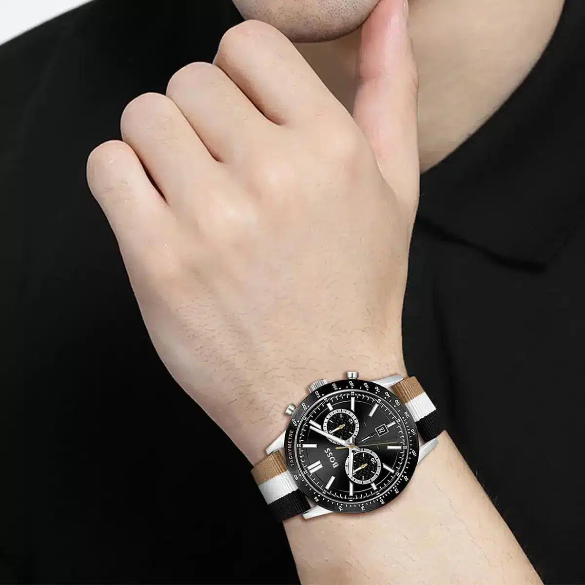 Hugo Boss Allure chronograph watch worn on wrist showing black dial and multicolor striped strap