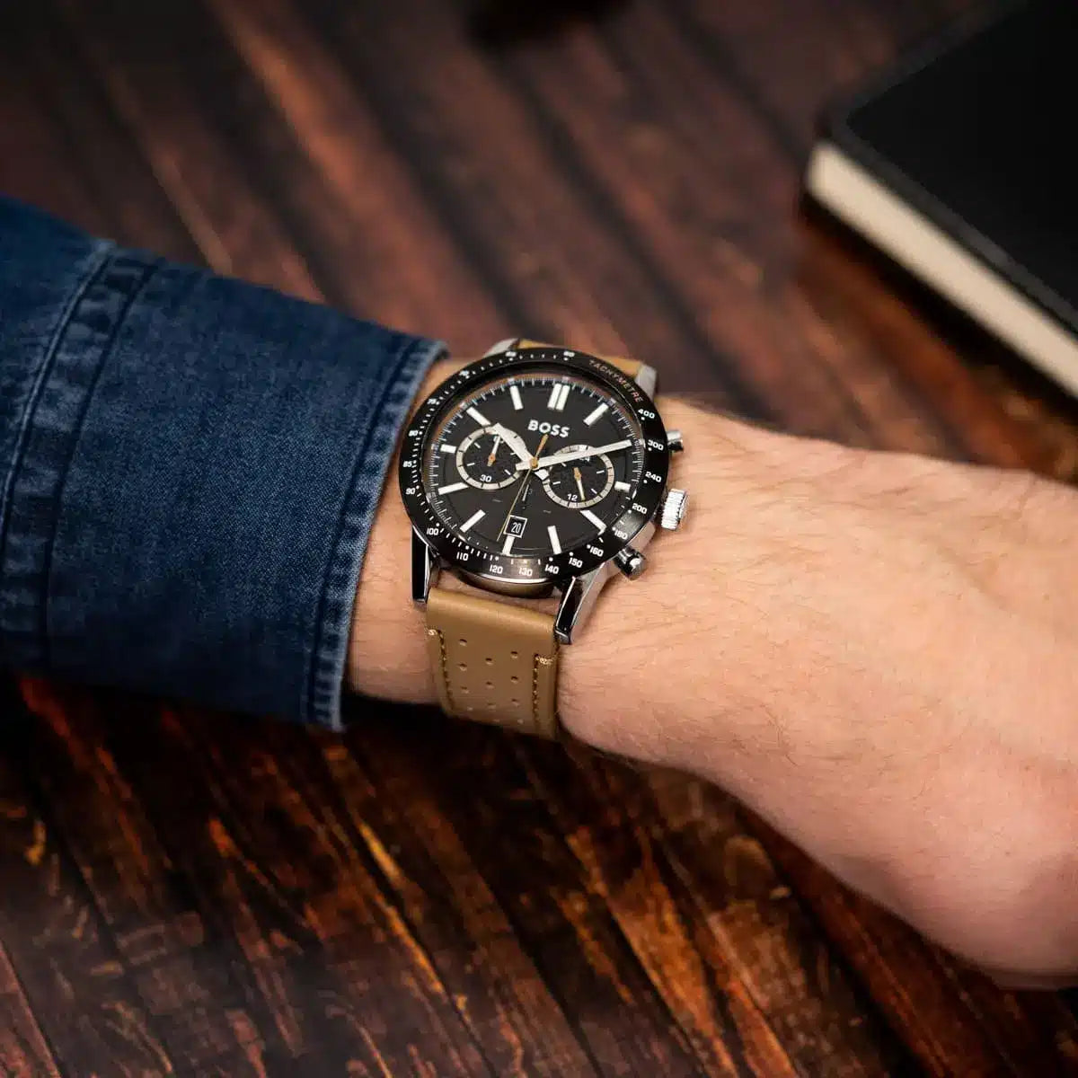 Hugo Boss Allure chronograph watch worn on wrist with denim sleeve