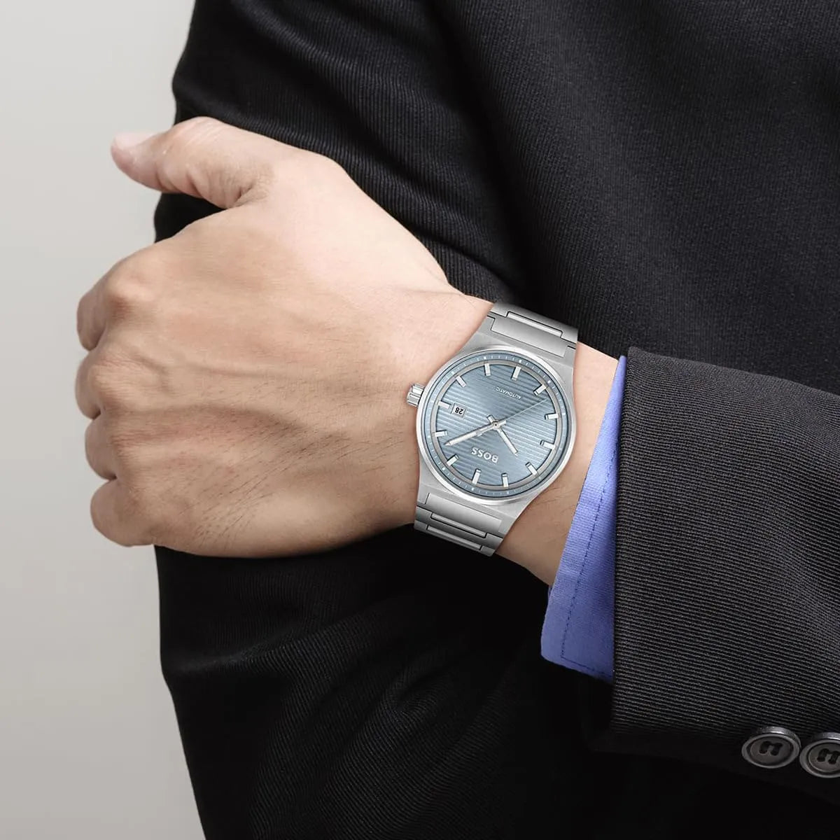 Hugo Boss Candor men's watch worn on wrist showing blue dial and automatic movement