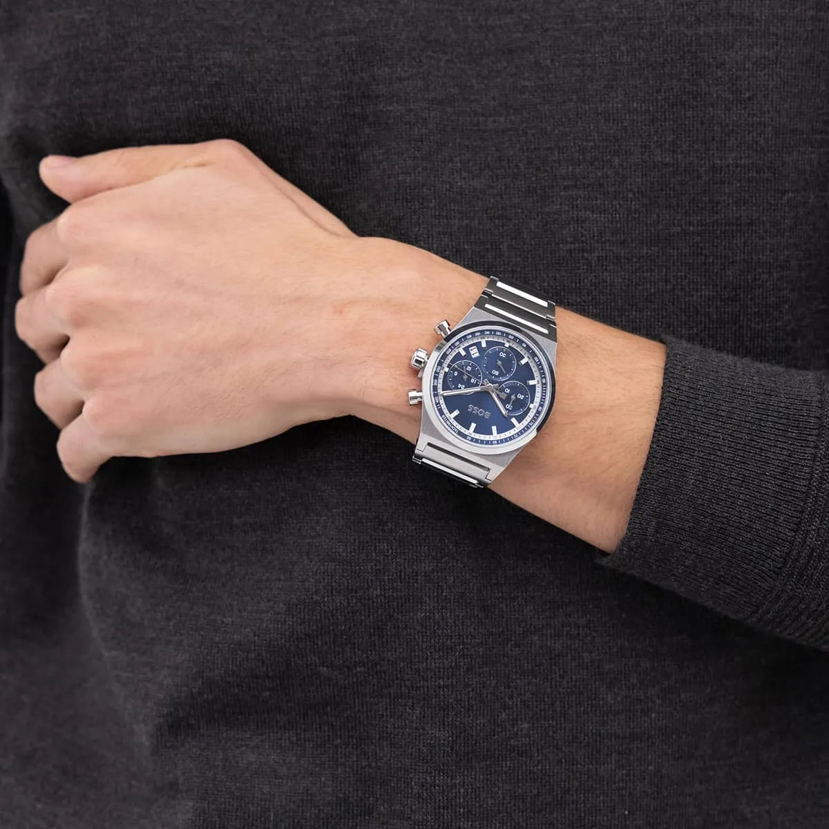 Hugo Boss Candor chronograph watch worn on wrist with blue dial visible