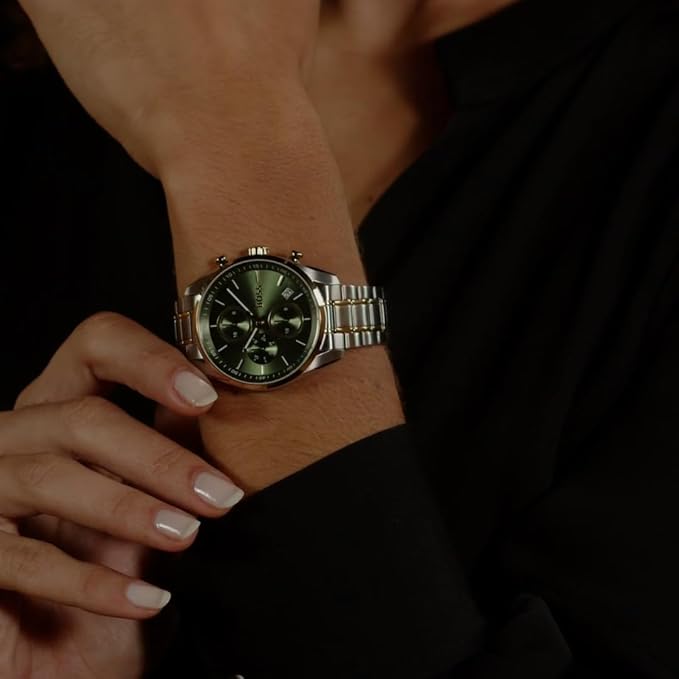 HUGO BOSS Grand Tour chronograph watch worn on wrist with green dial and two-tone bracelet