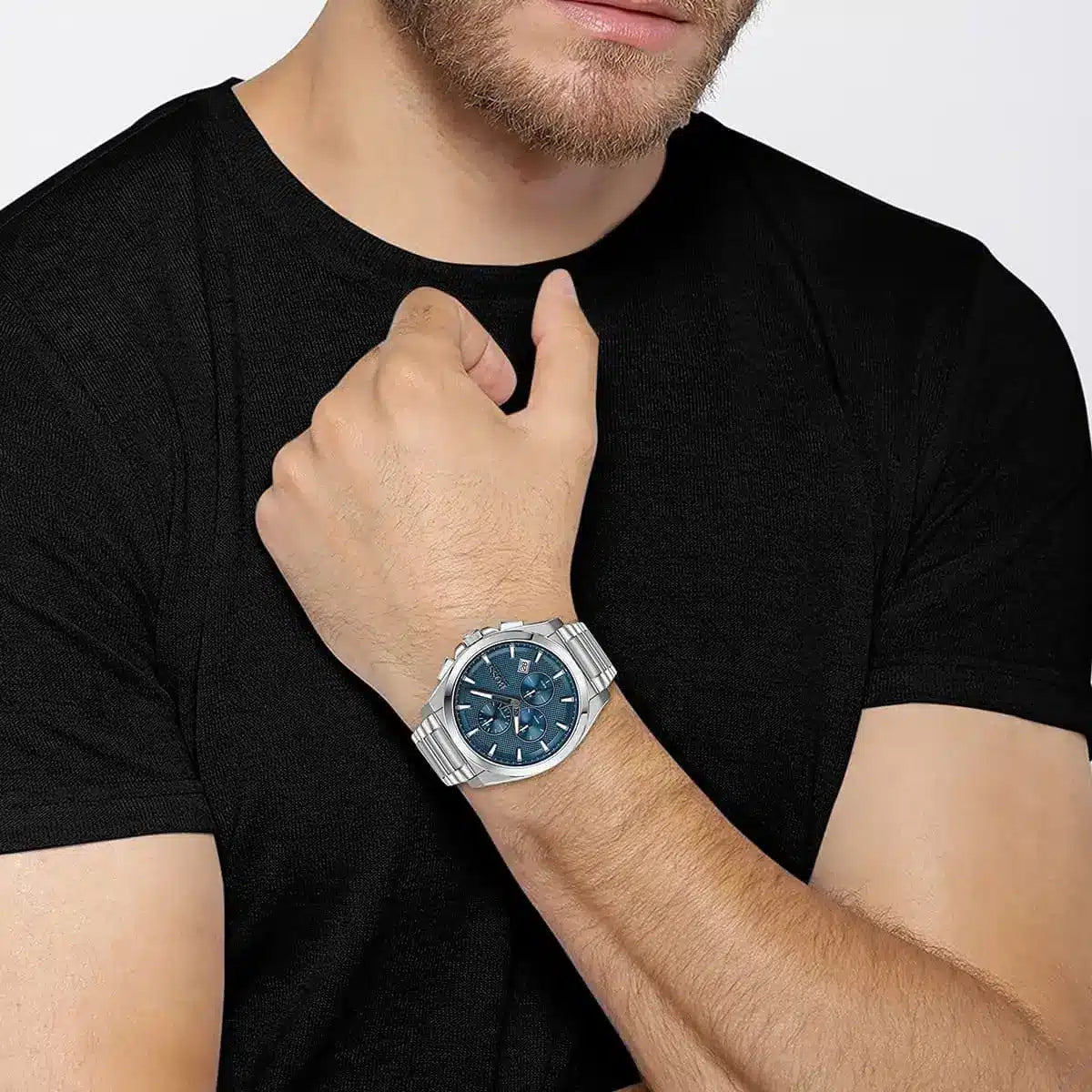 Hugo Boss Grandmaster chronograph watch worn on wrist showing blue dial and steel bracelet