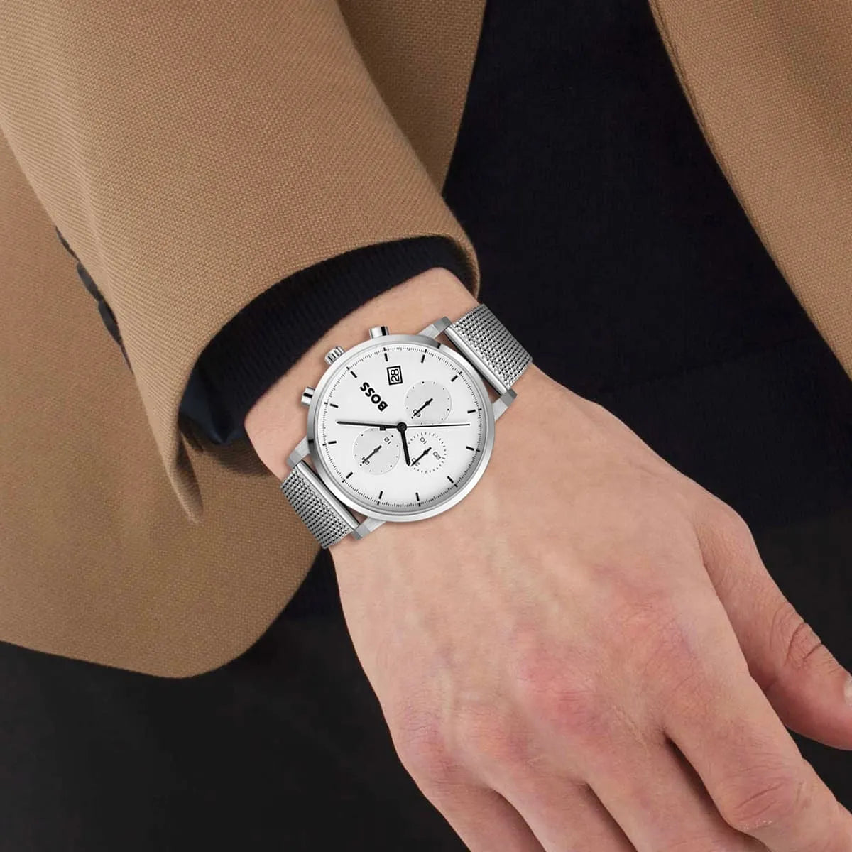Hugo BOSS Integrity watch on wrist showing white dial and mesh bracelet with business wear