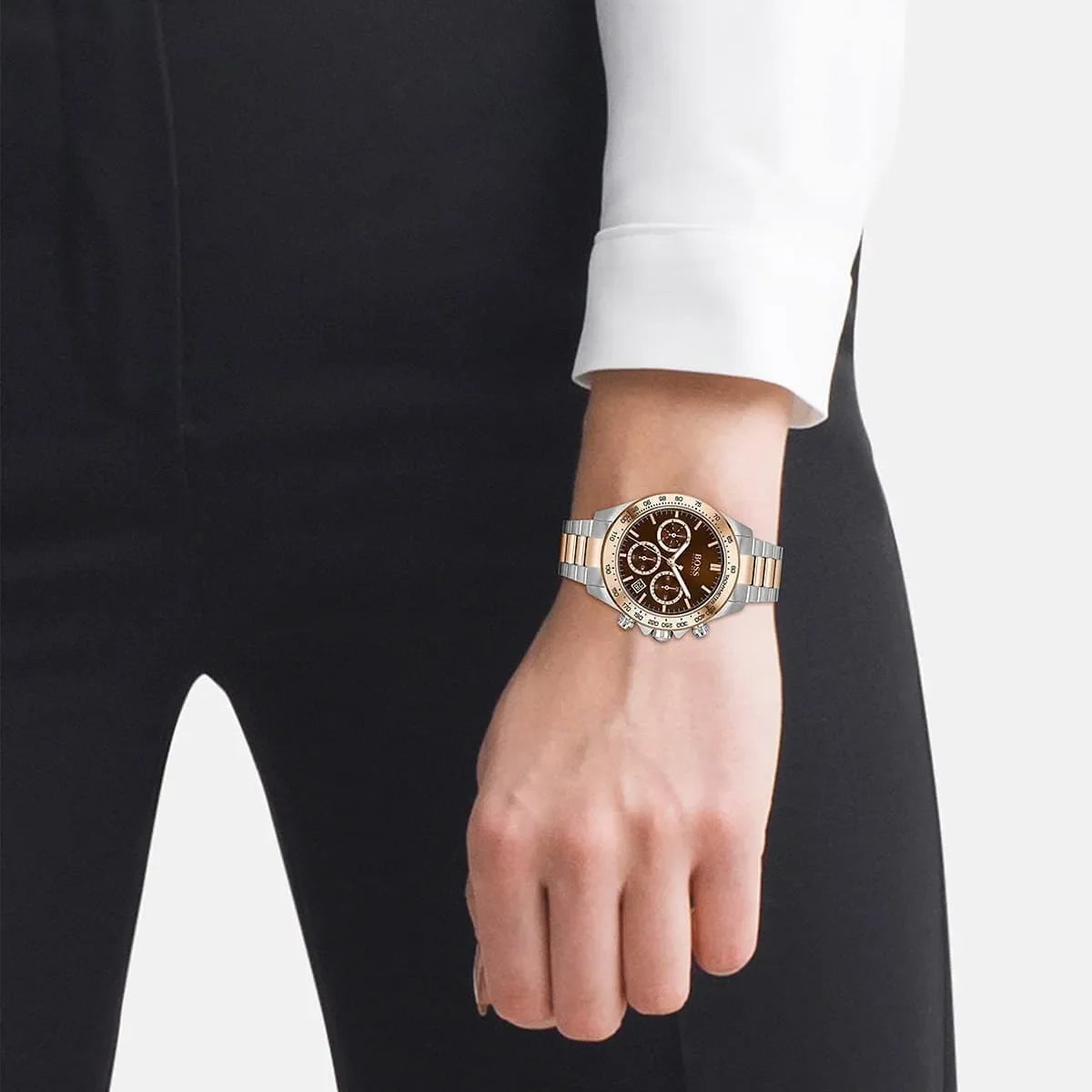 Hugo Boss Novia chronograph watch worn on wrist showing brown dial and two-tone stainless steel bracelet