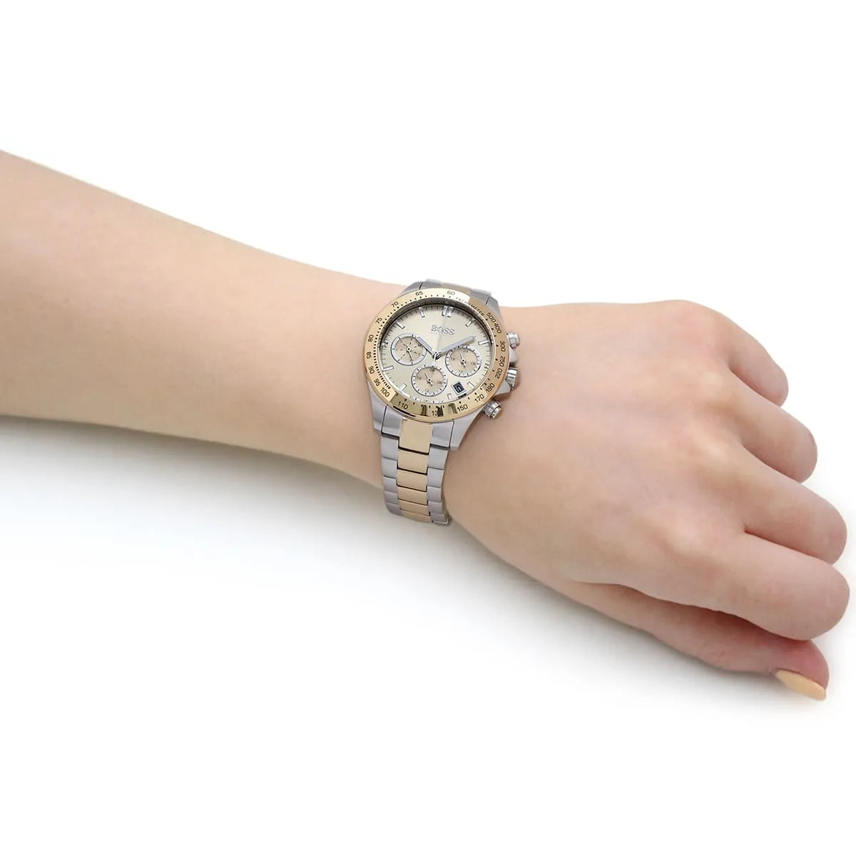 Hugo Boss Novia chronograph watch worn on wrist showing gold dial and two-tone bracelet