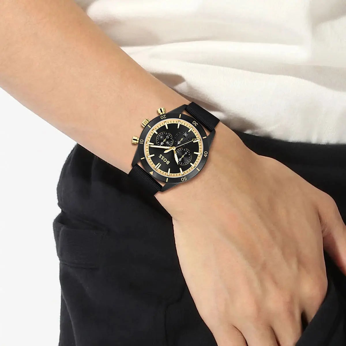 Hugo Boss Santiago chronograph worn on wrist showing black dial with gold accents