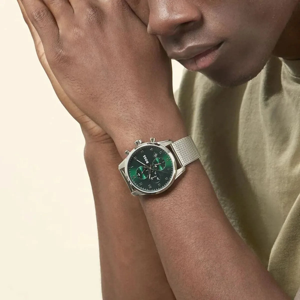 Hugo Boss Skymaster watch on wrist detail view of green chronograph dial