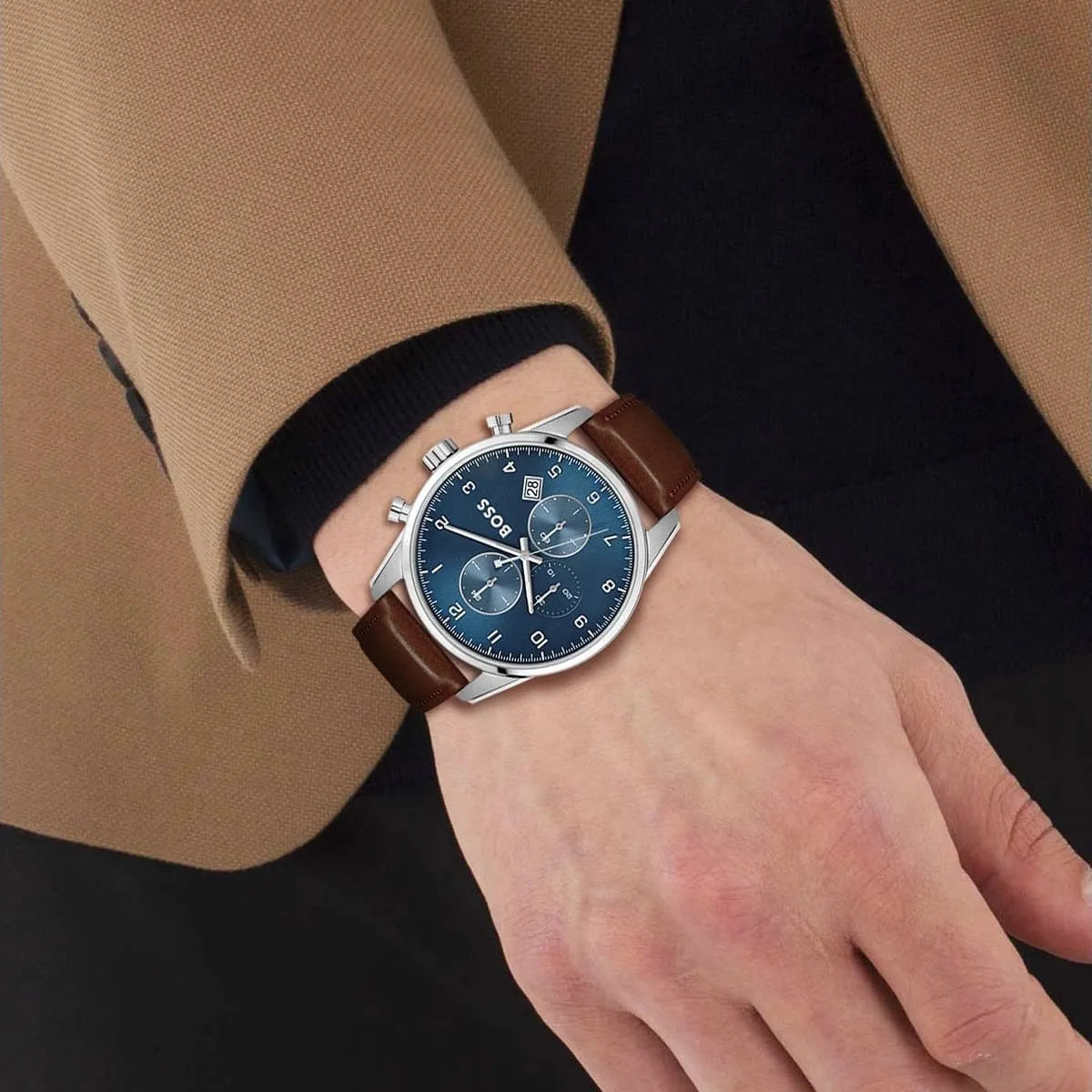 Hugo Boss Skymaster chronograph watch worn on wrist with blue dial and brown leather strap