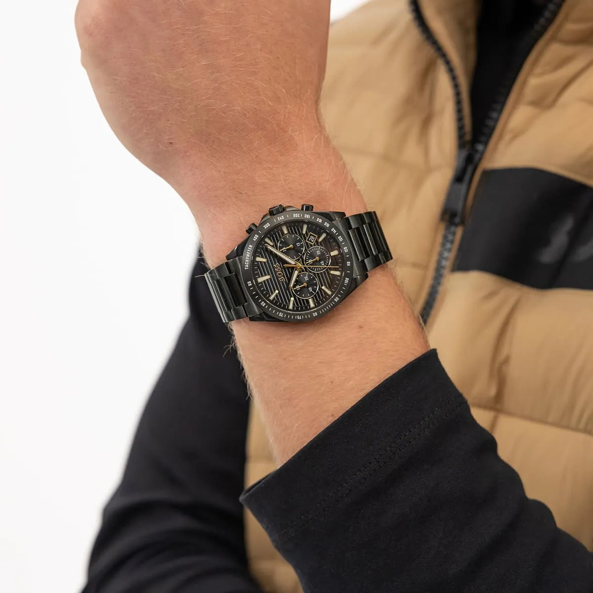 Hugo Boss Strike chronograph watch worn on wrist showing black dial with gold hands and indices