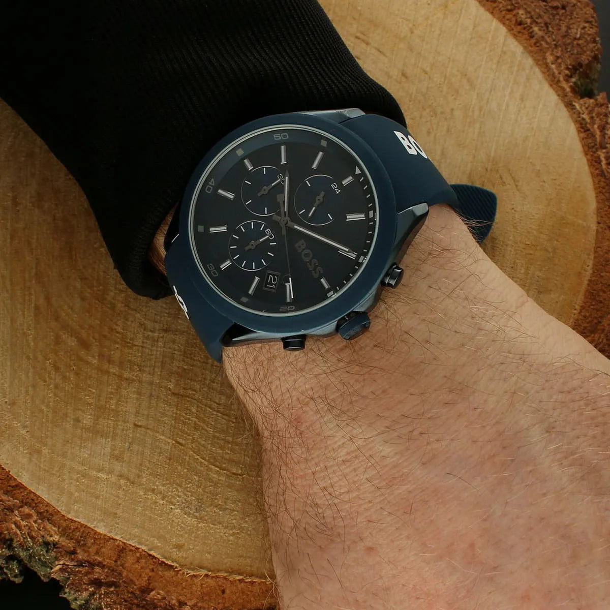 Hugo Boss Velocity chronograph watch worn on wrist with blue rubber strap