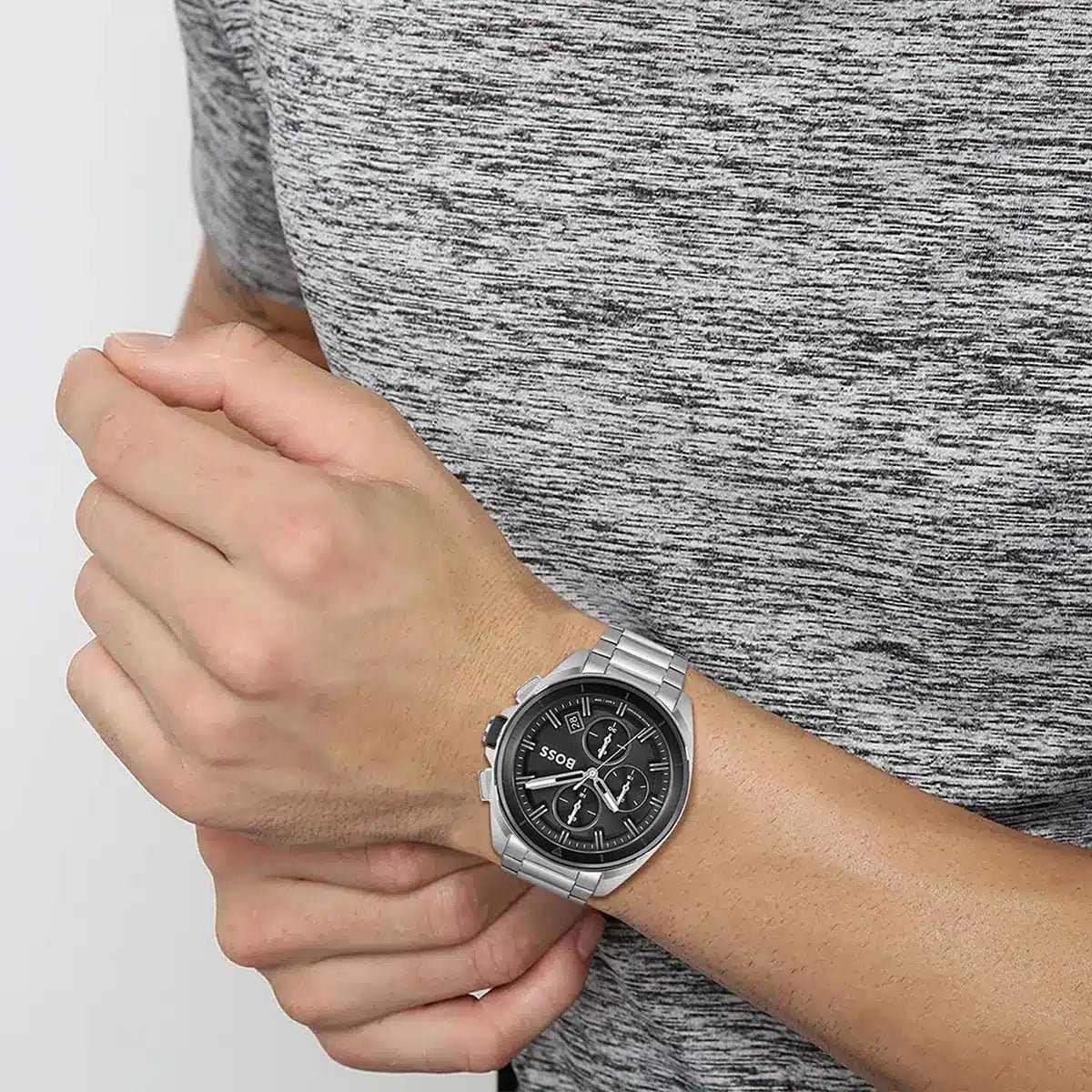 Hugo Boss Volane watch on wrist with gray sweater showing dial detail
