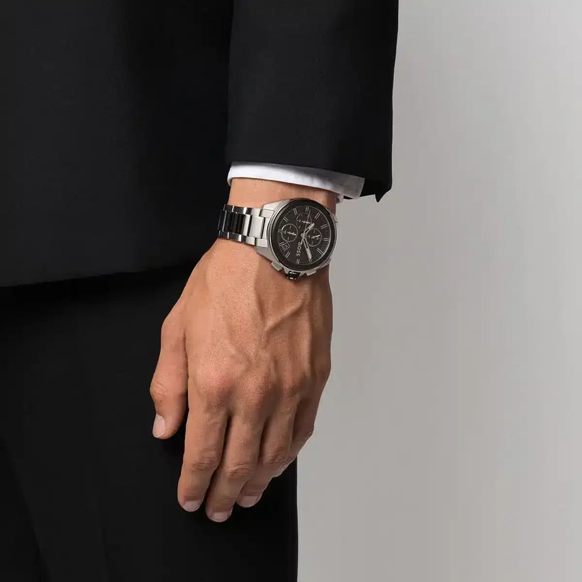 Hugo Boss Volane chronograph watch on wrist with formal black attire