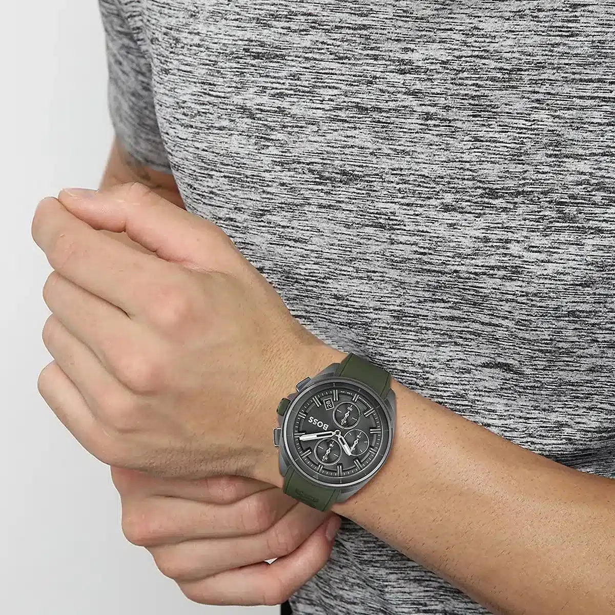Hugo Boss Volane chronograph watch worn on wrist with green rubber strap