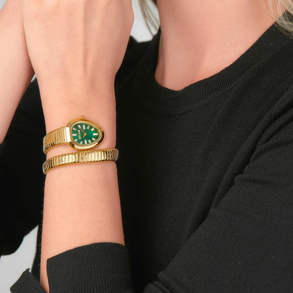 Just Cavalli Aversa watch worn on wrist with gold snake strap and green oval dial