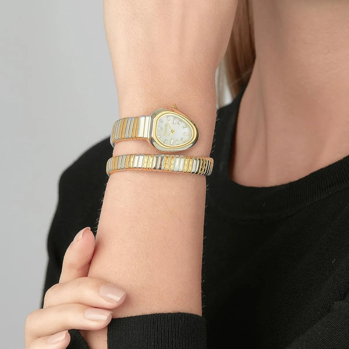 Just Cavalli Aversa women watch worn on wrist with two-tone silver gold snake bracelet