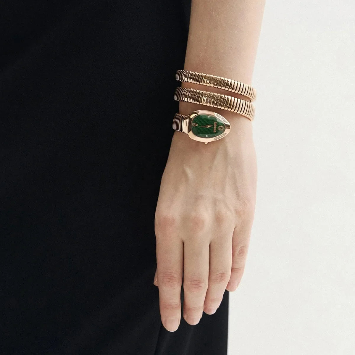 Just Cavalli Glam Evo 9 worn on wrist showing green dial and multi-wrap bracelet